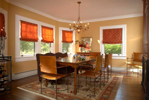 Formal dining room with updated double-hung windows, crown molding, and baseboard heat.